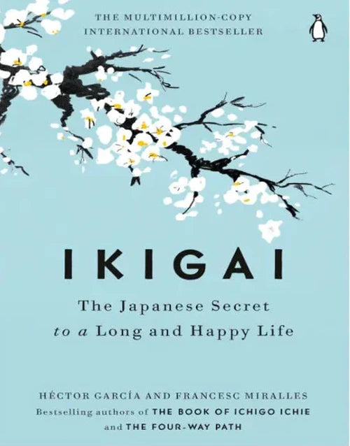Open copy of "Ikigai: The Japanese Secret to a Long and Happy Life" novel by Héctor García and Francesc Miralles on a plain background.